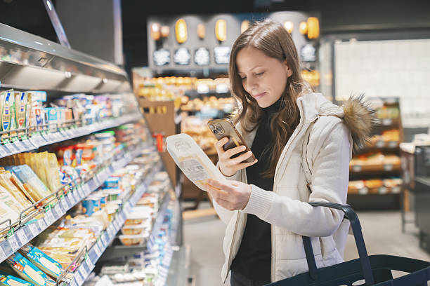 Consumer scanning a QR code on food packaging for information